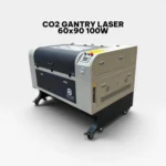 Side perspective of the Hao Tian 100W CO2 Gantry Laser machine featuring a 60x90 cm bed, digital control panel, and sturdy floor-standing chassis on wheels.