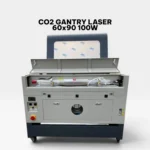 Rear view of the 60x90 CO2 Gantry Laser showing the 100W glass laser tube installation and cooling system connections.
