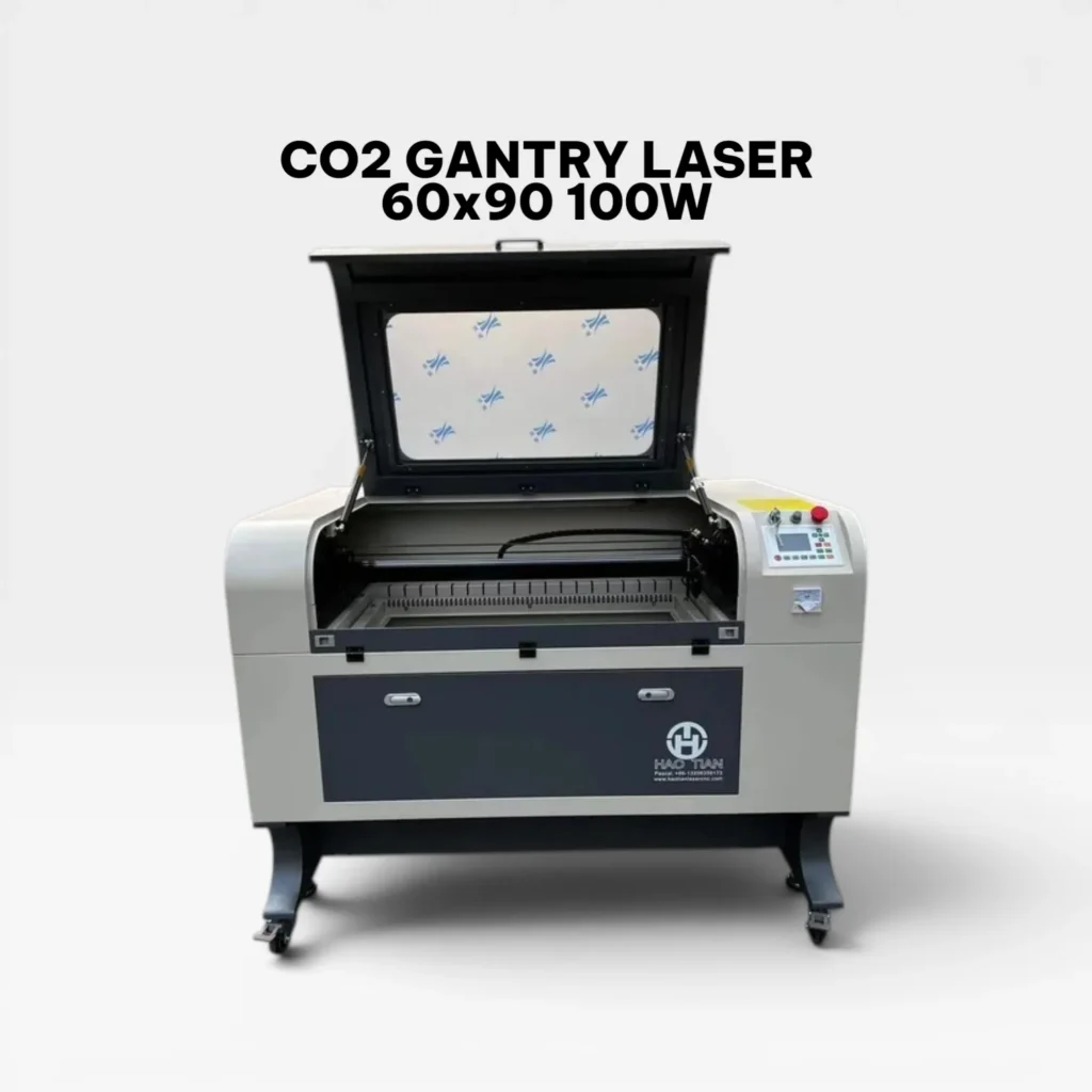 Front view of a Hao Tian CO2 Gantry Laser machine with the top lid open, showcasing the 60x90 cm work area and honeycomb bed.