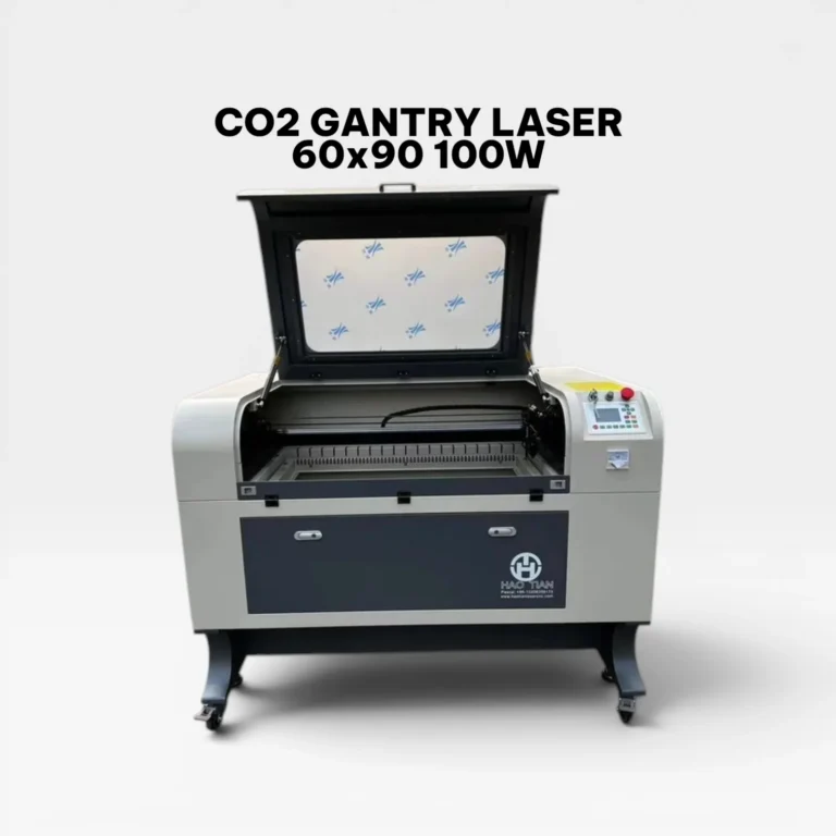 Front view of a Hao Tian CO2 Gantry Laser machine with the top lid open, showcasing the 60x90 cm work area and honeycomb bed.