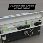 100W CO2 laser glass tube installed in the rear compartment of a gantry laser machine.