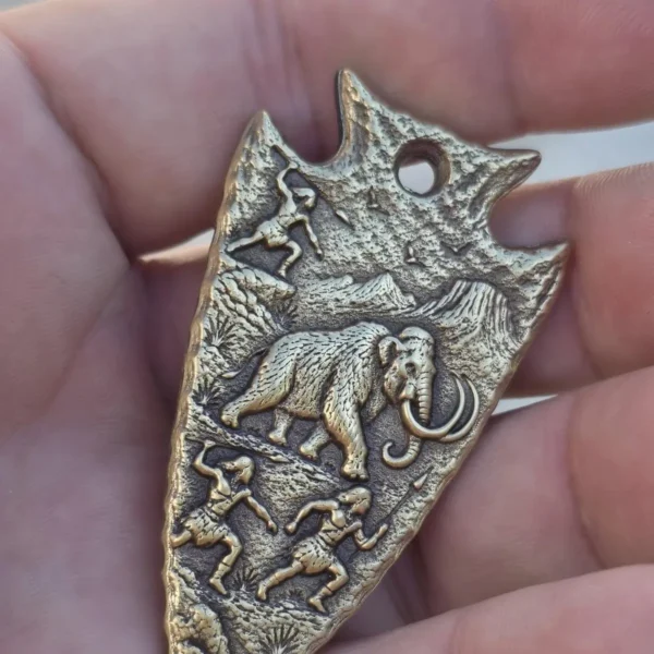 Brass arrowhead pendant with 3D relief mammoth hunt scene engraved with 100W JPT M7 MOPA fiber laser