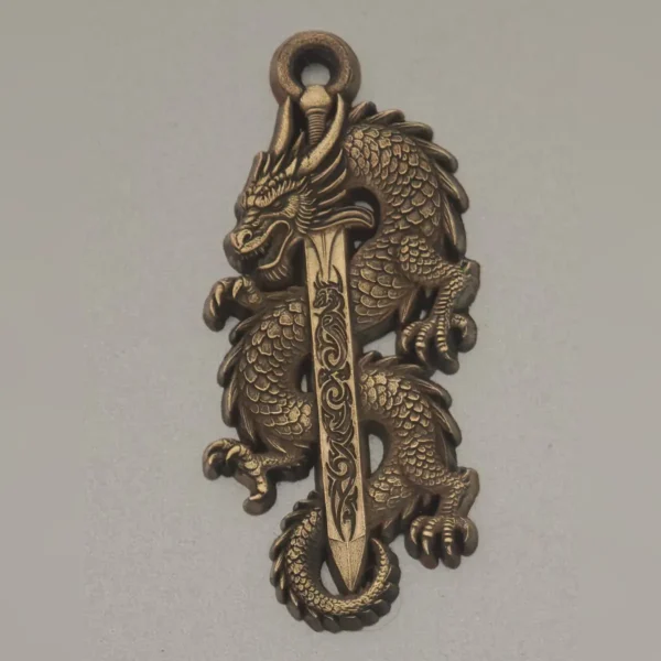 Brass pendant with 3D relief dragon and sword made with a 60W JPT EM7 fiber laser