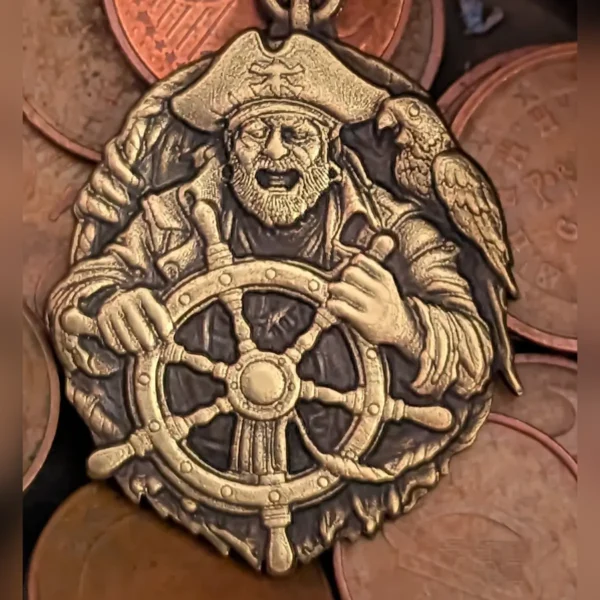 Brass pendant with 3D relief pirate, parrot and ship wheel engraved with 60W JPT EM7 MOPA fiber laser