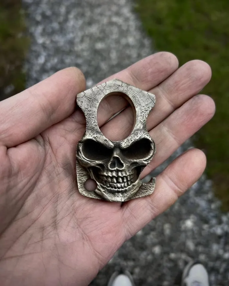 Skull knuckle bottle opener with 3D relief engraving