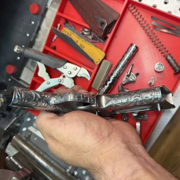 1911 pistol frame with scrollwork engraving made with a 100W JPT M7 fiber laser