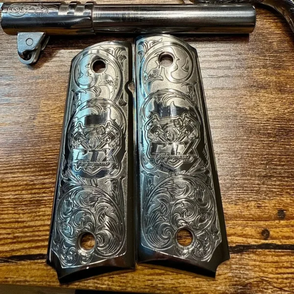 Stainless steel 1911 grips engraved with scrollwork and a custom logo using 100W JPT M7 MOPA fiber laser